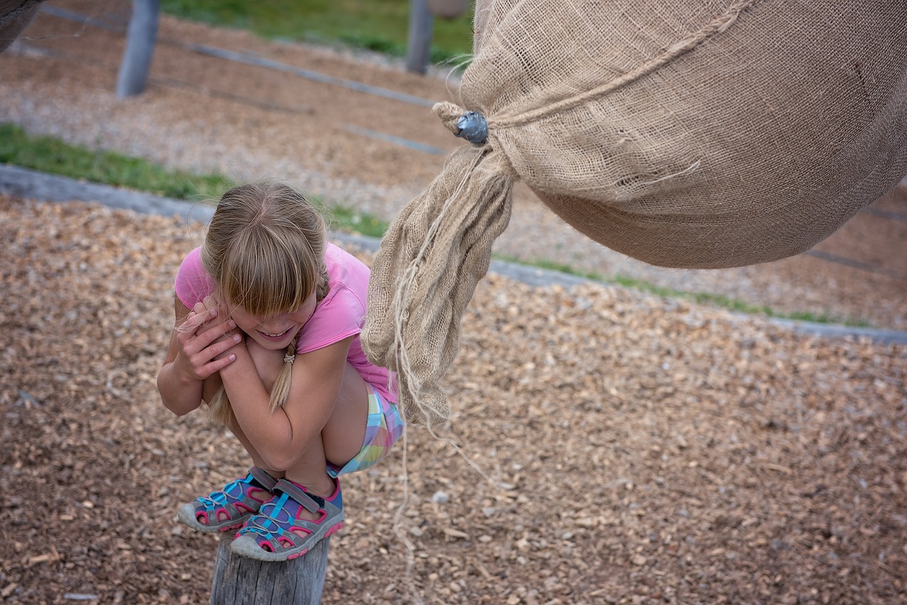 Image - girl child play out sack game